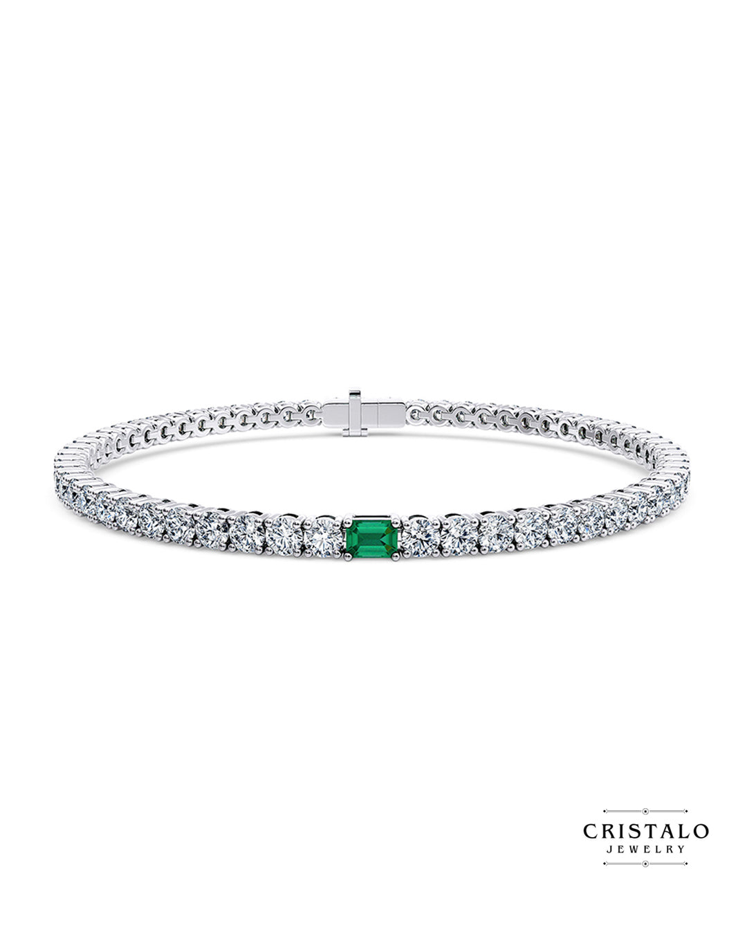 Elegant white gold Ivy bracelet with emerald centerpiece and sparkling diamonds.