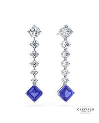 Glisten and gleam in our Astra linear drop earrings — a galaxy of diamonds which highlight a mesmerising tanzanite gemstone.