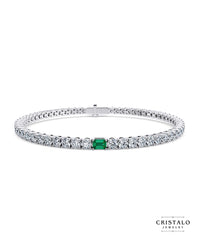 Elegant white gold Ivy bracelet with emerald centerpiece and sparkling diamonds.