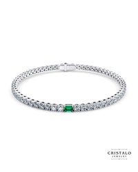 Ivy tennis bracelet in 18k white gold with 3.90ct lab-grown diamonds and green emerald.