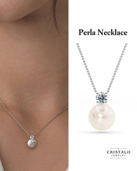 Elegant white gold pendant with subtle diamond sparkle, adjustable 16–18" chain.